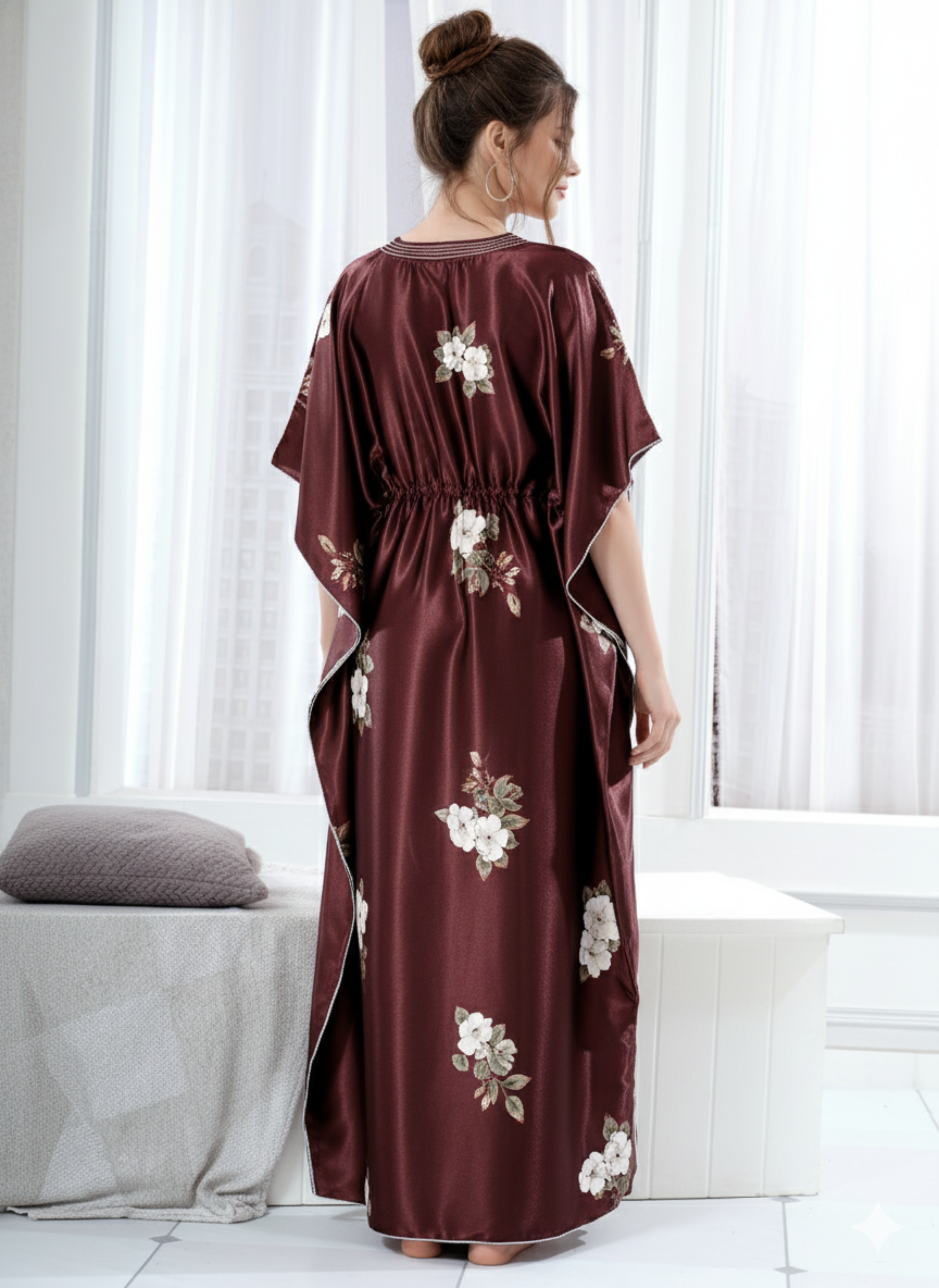 Back view of brown floral satin kaftan showing flowy full length fit and white hem trim