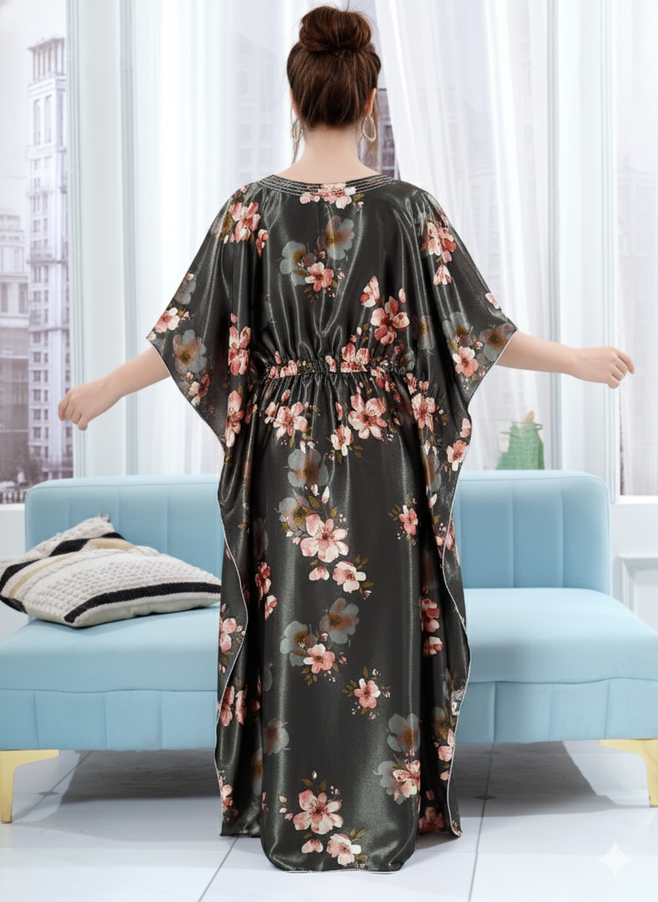 Back view of charcoal grey floral satin kaftan showing flowy full length fit and white hem trim