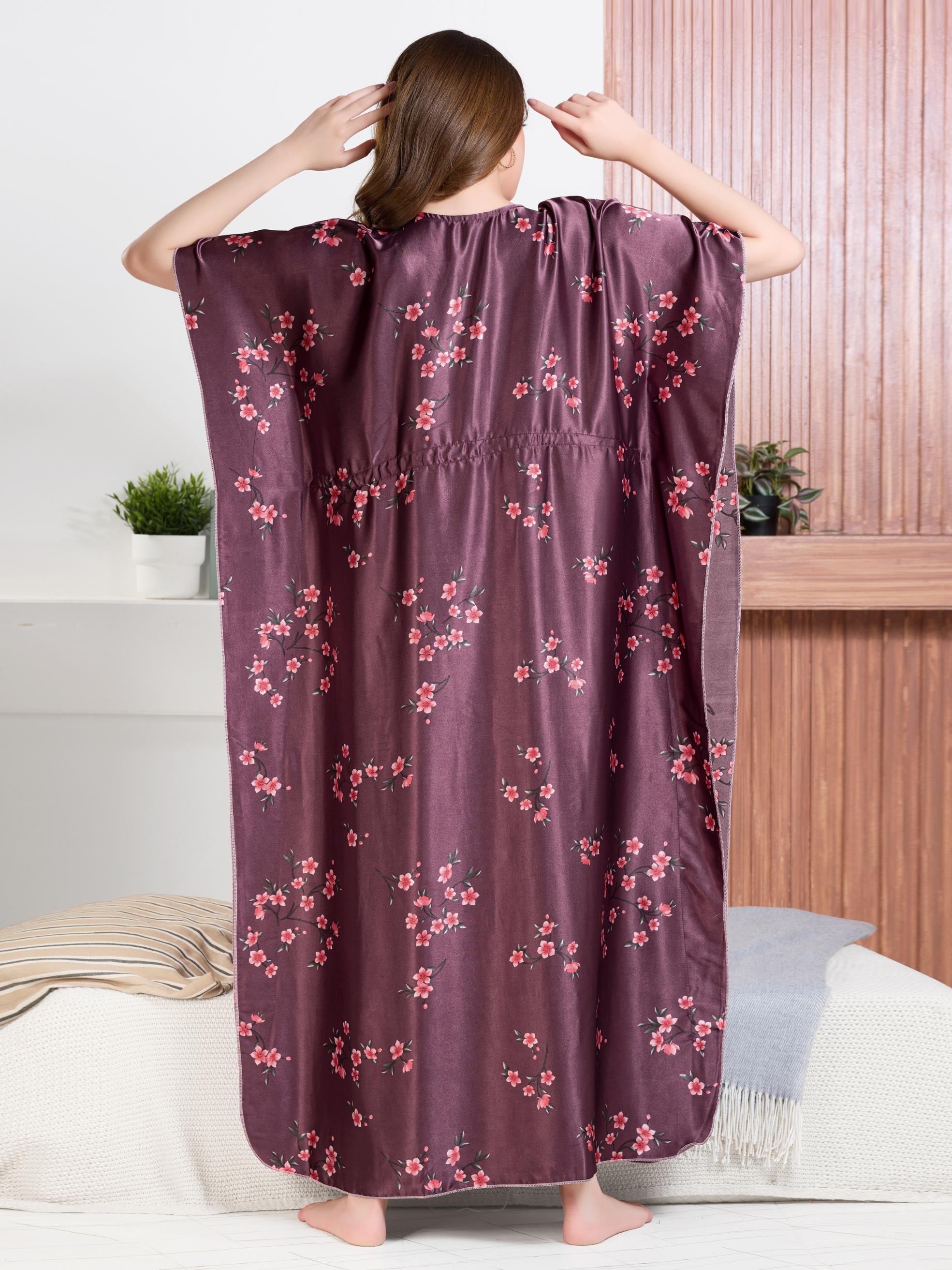 Back view of wine plum satin floral kaftan with flowy drape