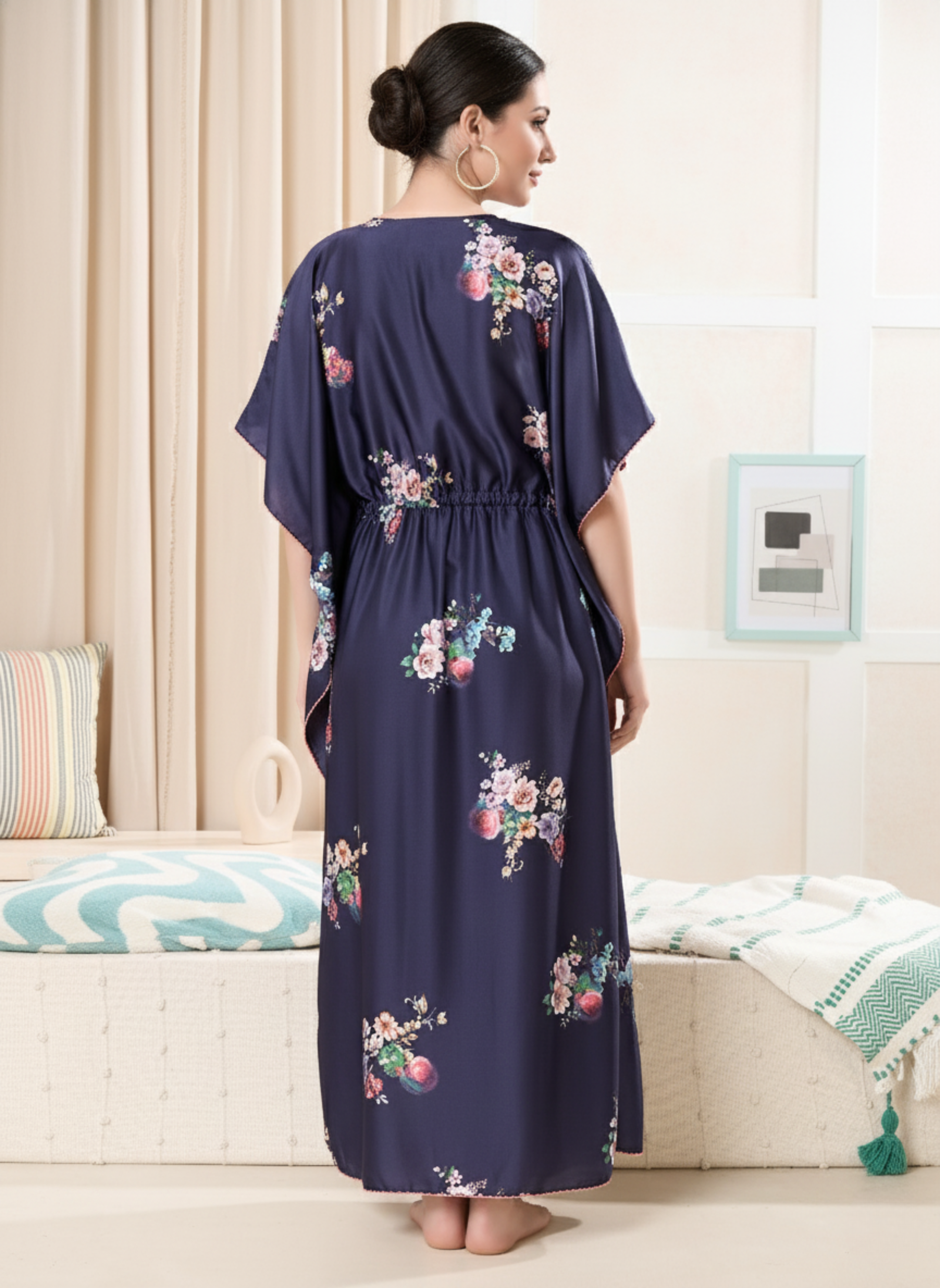 Back view of navy blue floral satin kaftan showing flowy full length fit and pink hem trim