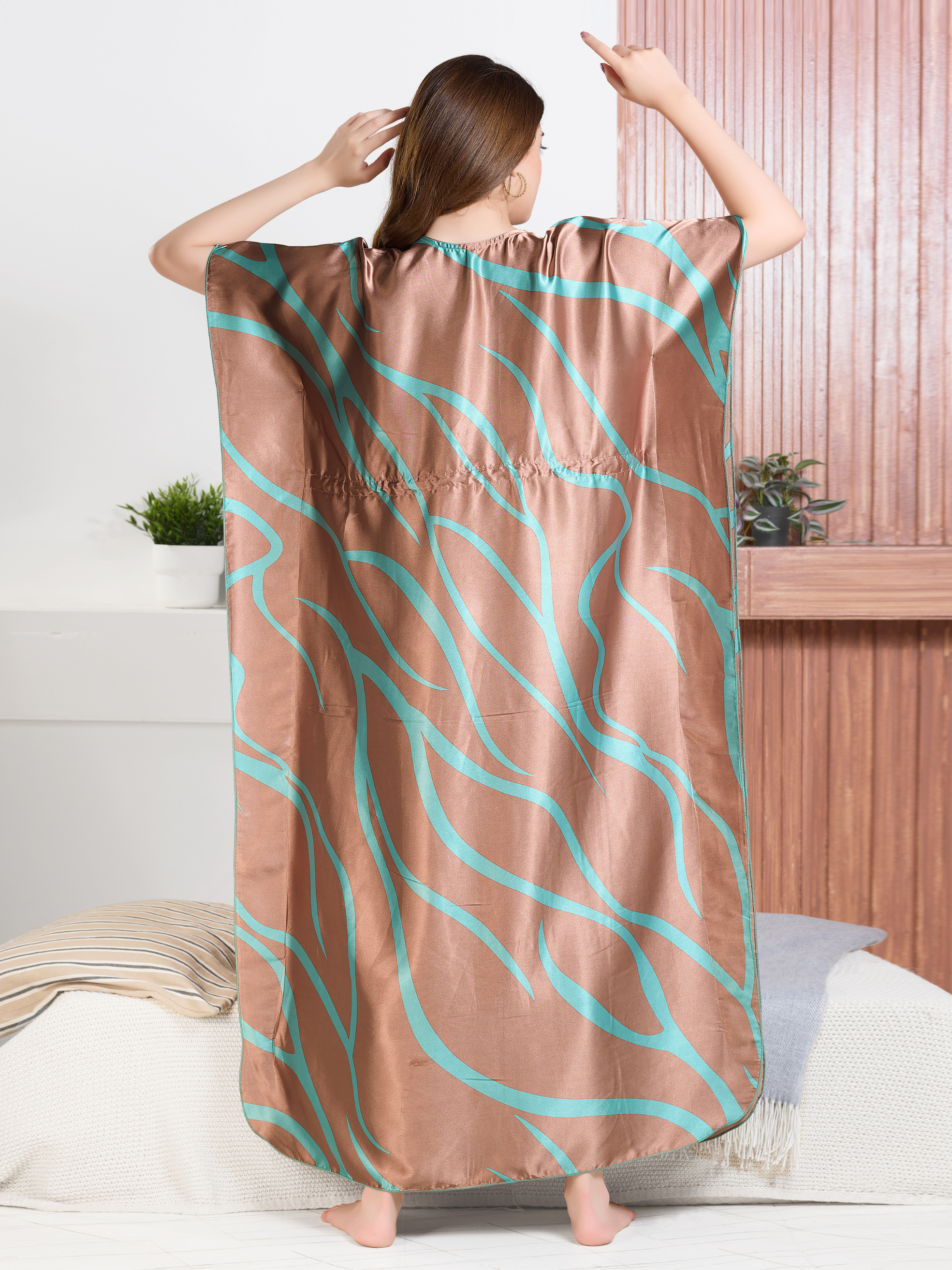 Flowy satin kaftan for women showing relaxed fit and teal abstract design from back