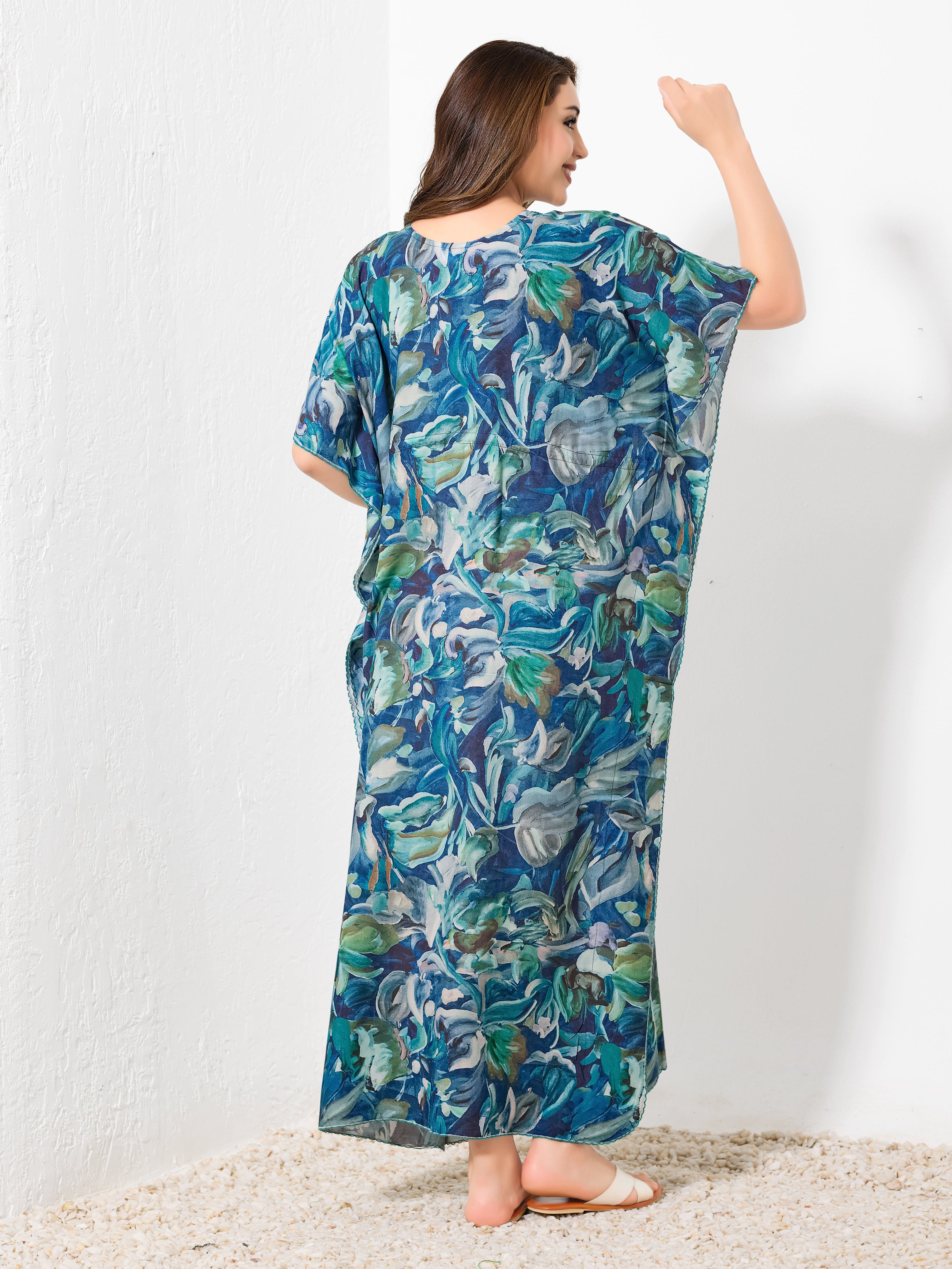 Back view of blue cotton abstract kaftan showing flowy full length fit and watercolor pattern