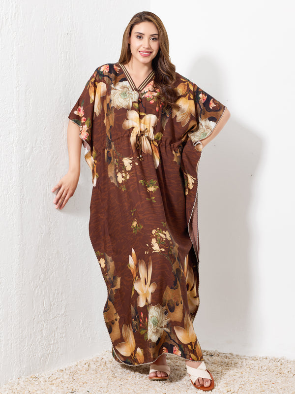 Model standing wearing brown premium cotton kaftan for women with beige floral print and drawstring waist