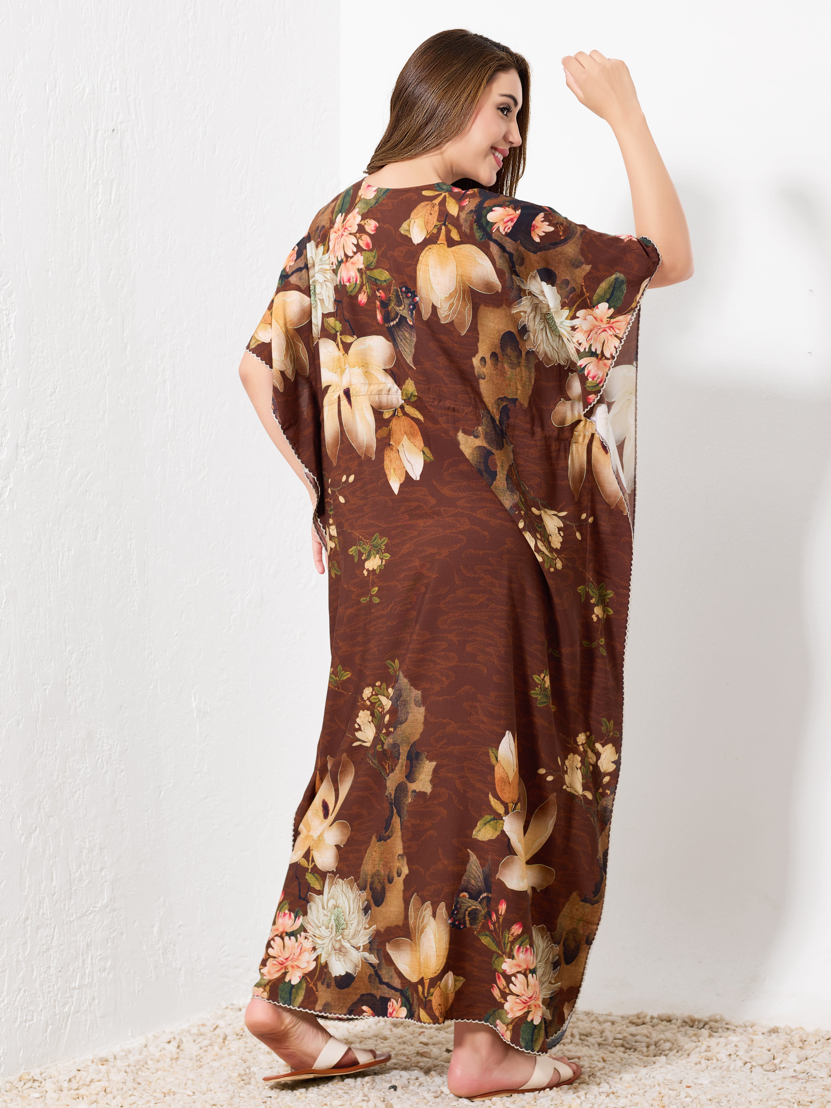 Back view of brown cotton floral kaftan showing flowy full length fit and picot hem trim