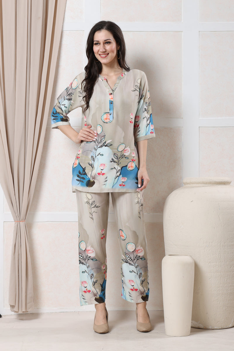 Model wearing beige linen floral co-ord set for women with blue and pink print on tunic and trousers