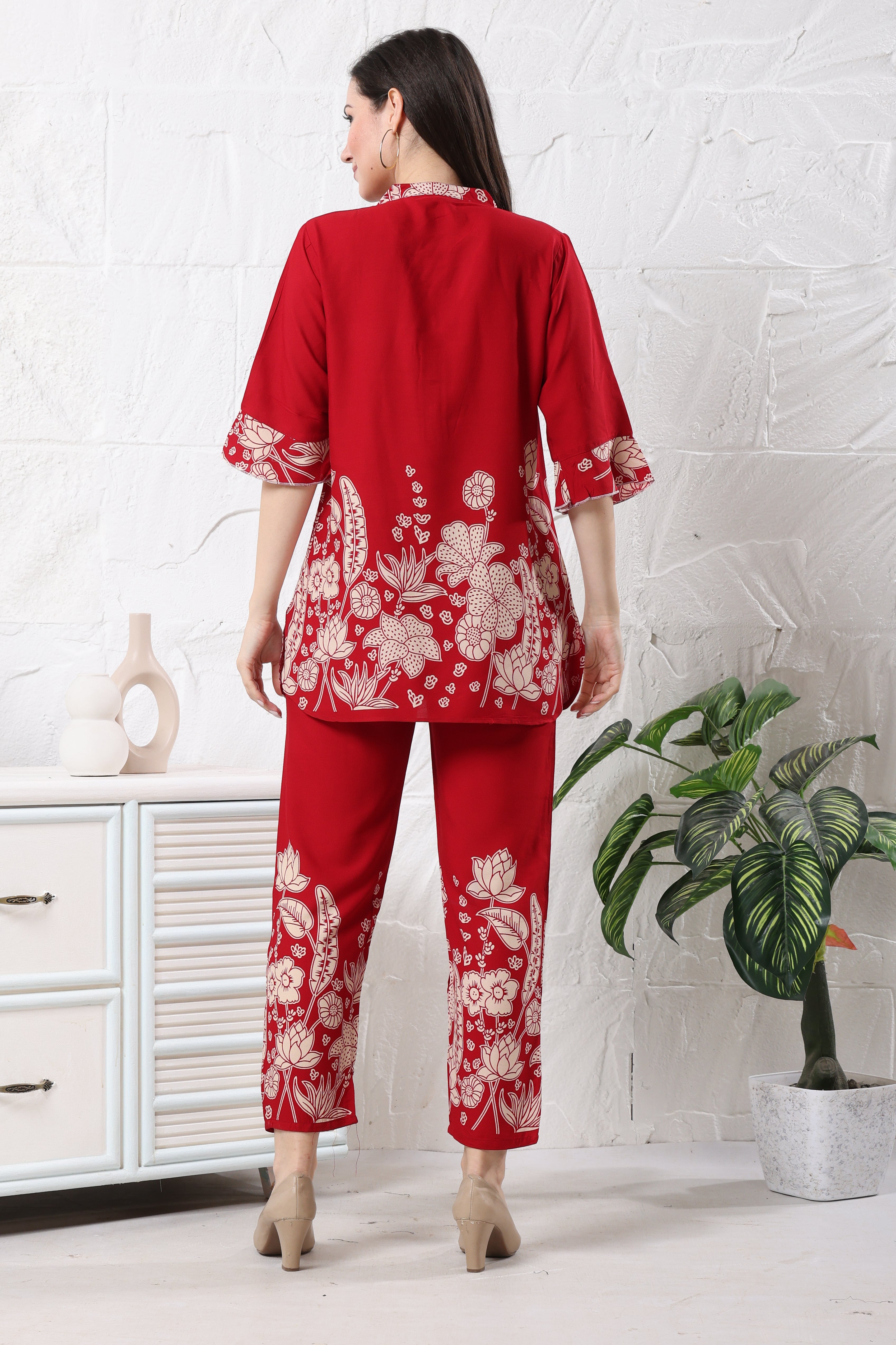 Back view of red linen floral co-ord set showing flowy tunic and fitted trousers