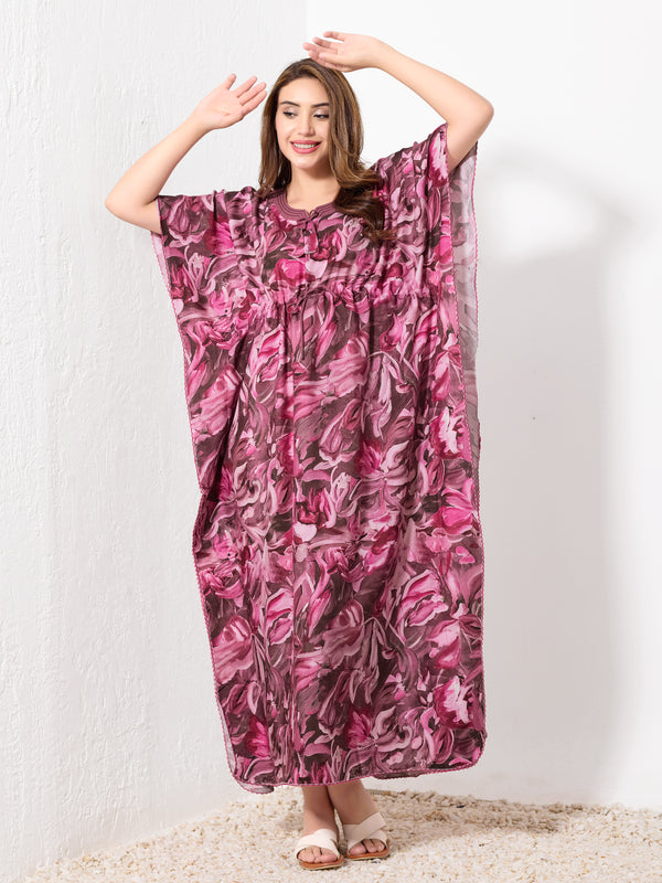 Model standing wearing pink and brown abstract print premium cotton kaftan for women with drawstring waist