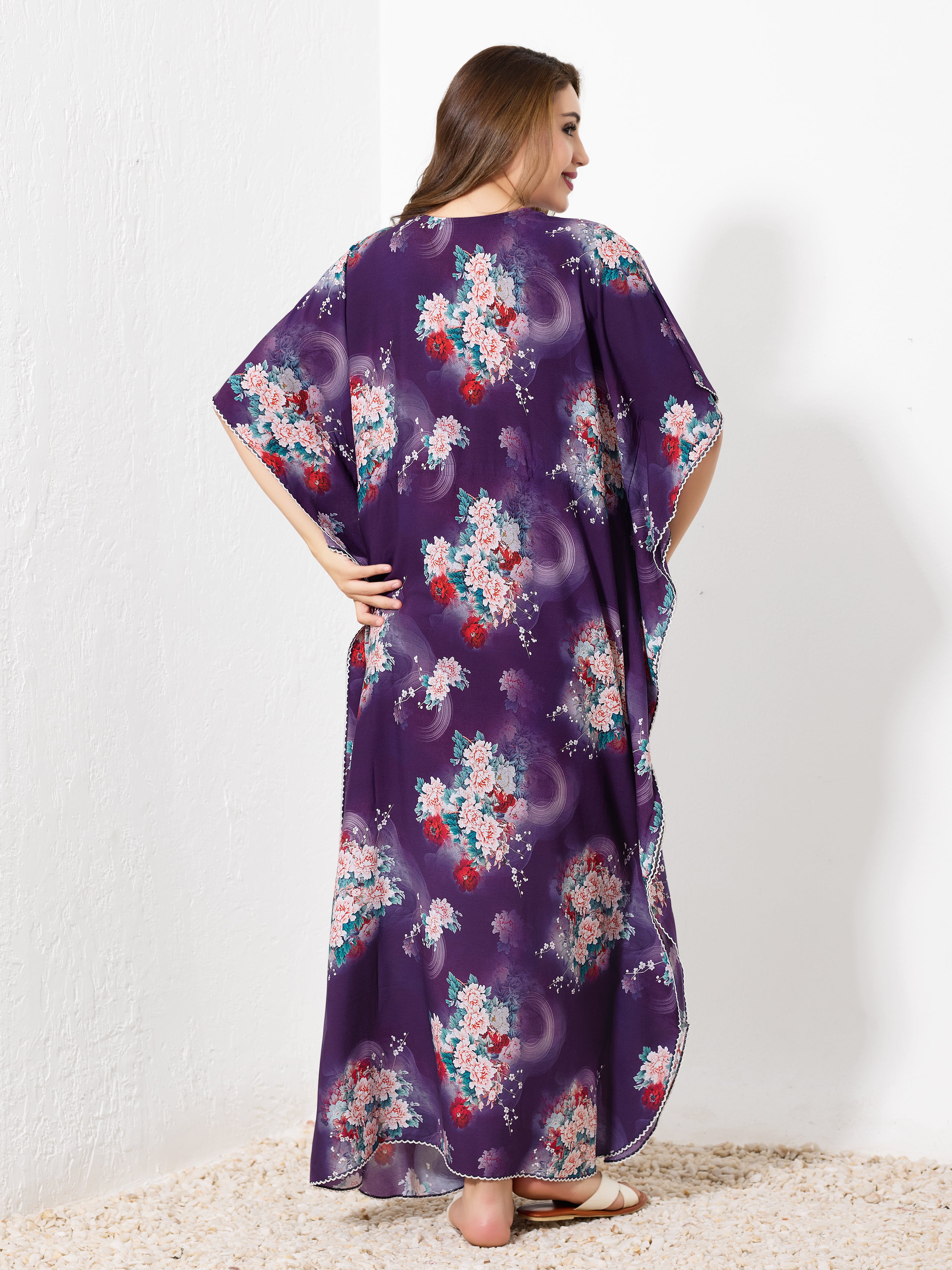 Back view of purple cotton floral kaftan showing flowy full length fit and white hem trim