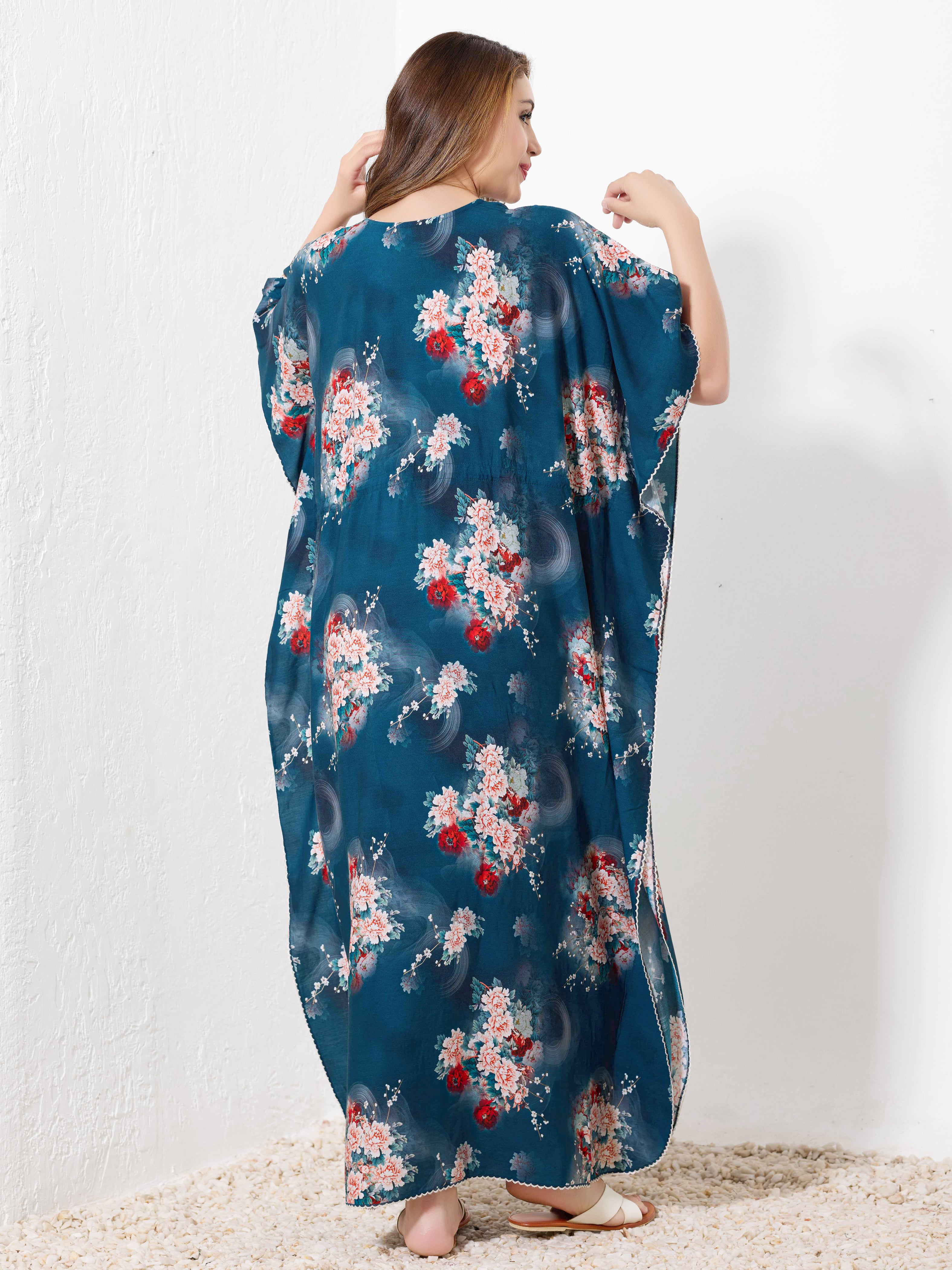Back view of teal blue cotton floral kaftan showing flowy full length fit and white hem trim